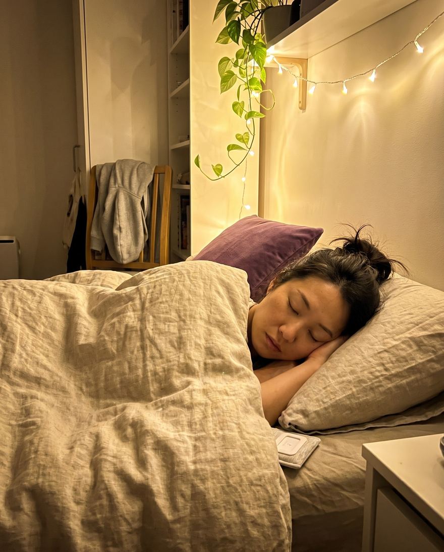 A woman asleep in a small flat