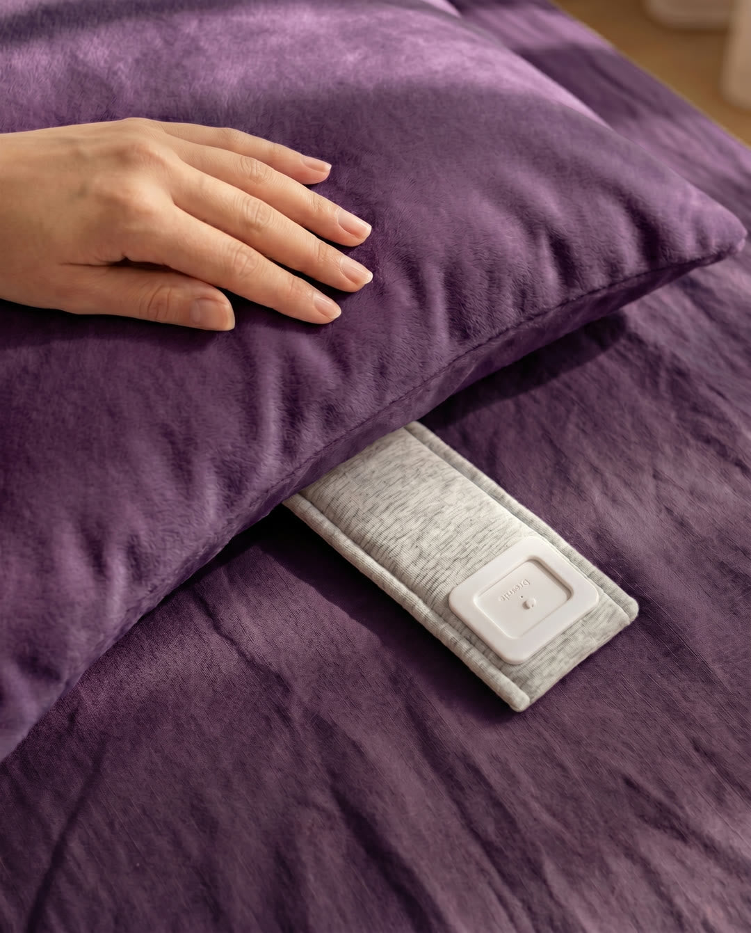 The Drowsie V3 speaker tucked under a pillow